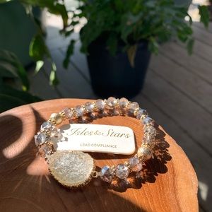 Silver and gold beaded bracelet with clear quartz pendant